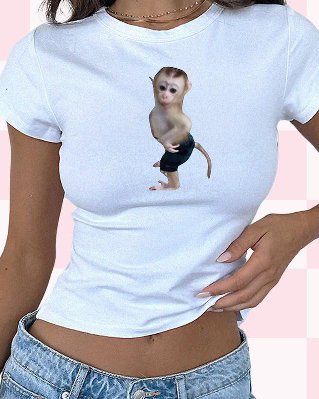 a woman wearing a white shirt with a monkey on it