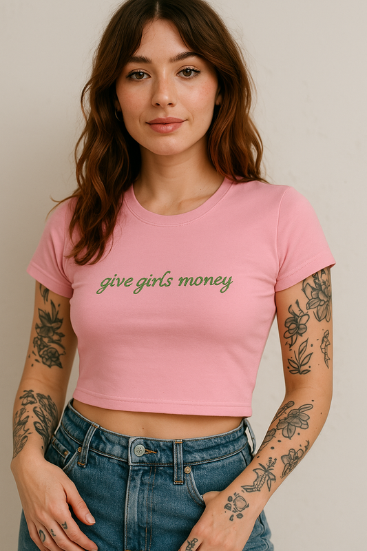 a woman wearing a pink crop top with the words give girls money on it