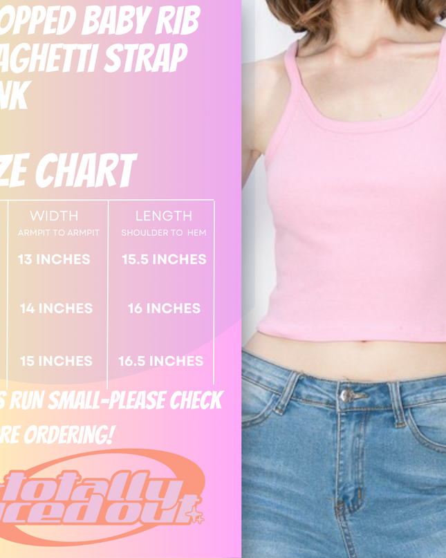 a woman in a pink tank top standing next to a wall