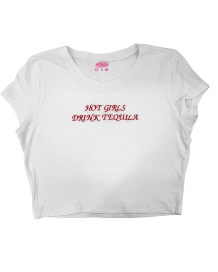 A white crop top with the text "HOT GIRLS DRINK TEQUILA" printed on it in red lettering.