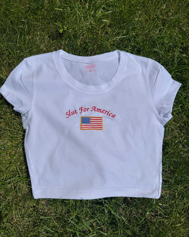 a white t - shirt with a flag on it