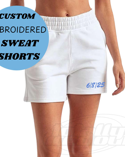 a woman wearing white shorts with the words custom embroidered sweat shorts