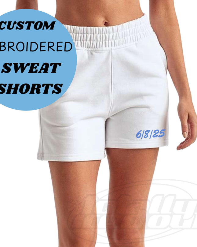 a woman wearing white shorts with the words custom embroidered sweat shorts