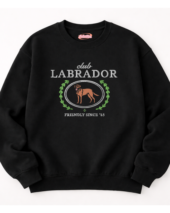 A black sweatshirt with a graphic design featuring a Labrador retriever and the text "club LABRADOR" and "FRIENDLY SINCE '85".