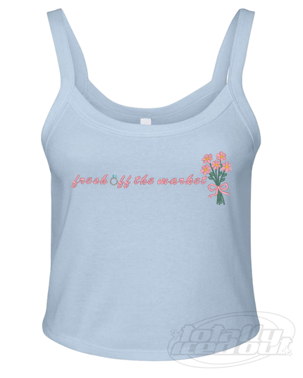 A light blue crop top with the text "fresh off the market" printed on it, along with a small floral design.