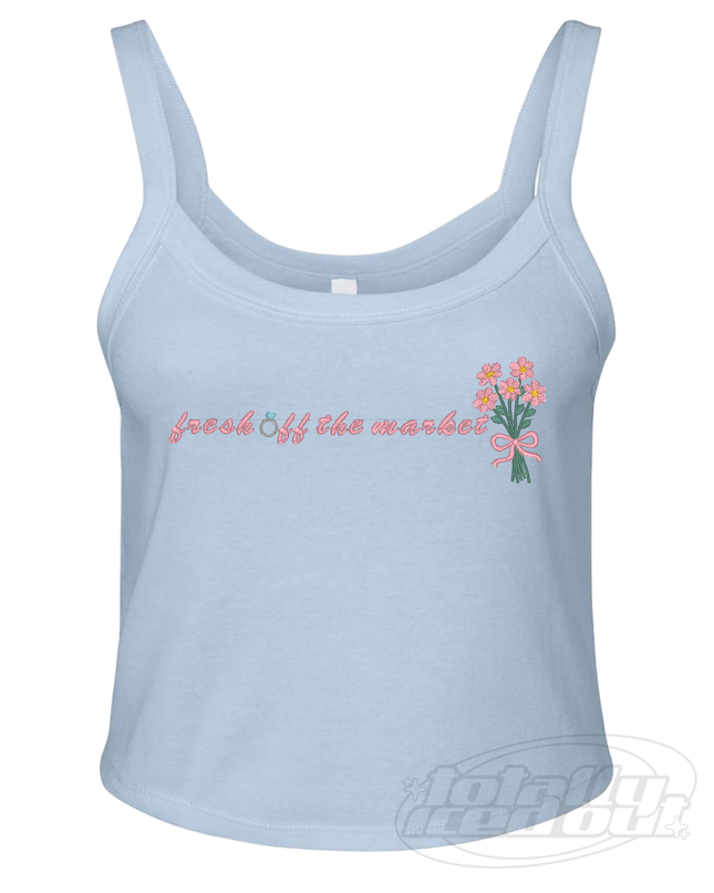 A light blue crop top with the text "fresh off the market" printed on it, along with a small floral design.