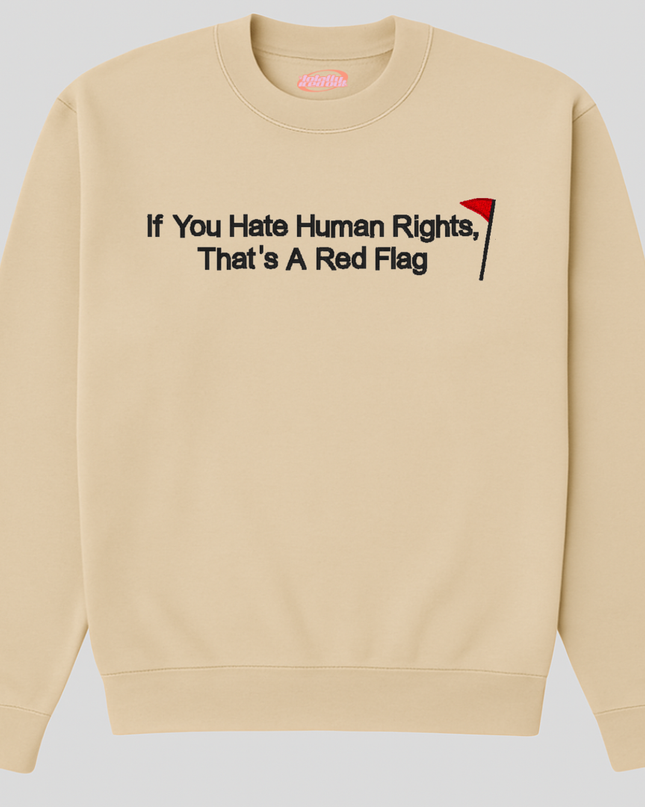 A beige sweatshirt with the text "If You Hate Human Rights, That's A Red Flag" printed on it.