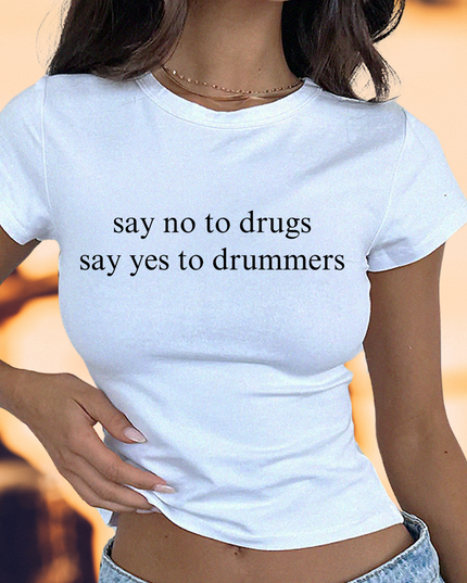 a woman wearing a white shirt that says say no to drugs say yes to drummer