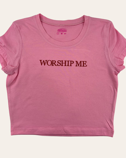 a pink shirt that says worship me