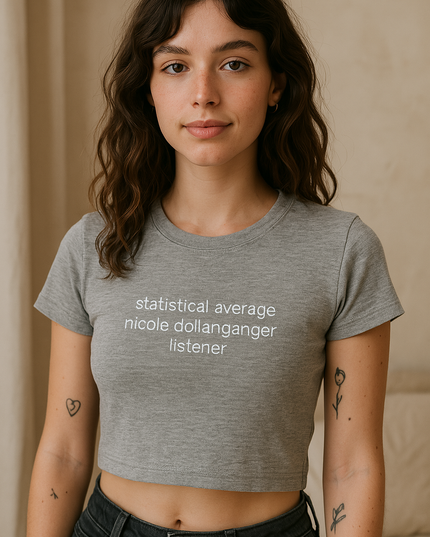 a woman wearing a grey shirt with a quote on it