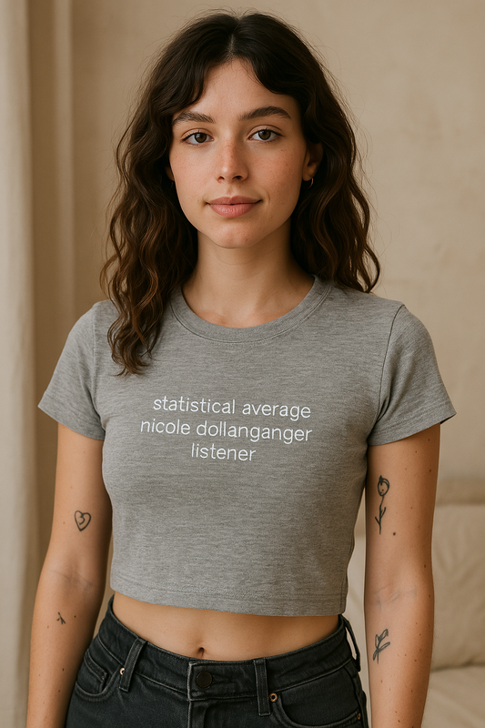 a woman wearing a grey shirt with a quote on it