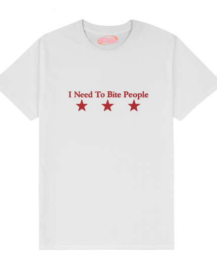 A white t-shirt with the text "I Need To Bite People" printed on it, along with three red stars.