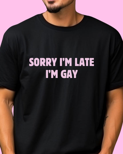 a man wearing a black shirt that says sorry i'm late i'm