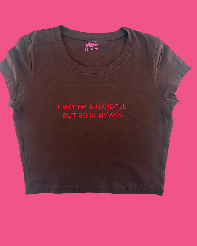a t - shirt that says i may be a handful but so is my ass