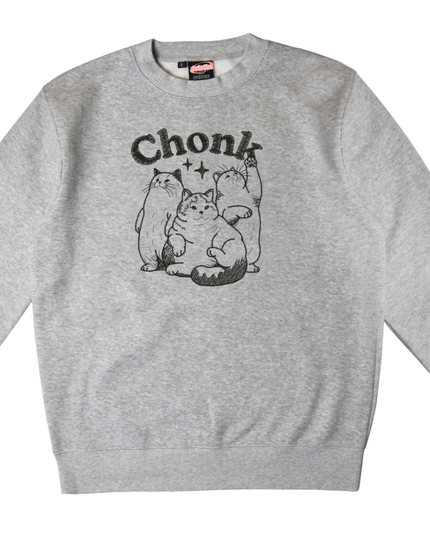 A gray sweatshirt with a black and white graphic design depicting three cats, along with the text "Chunk" above them.