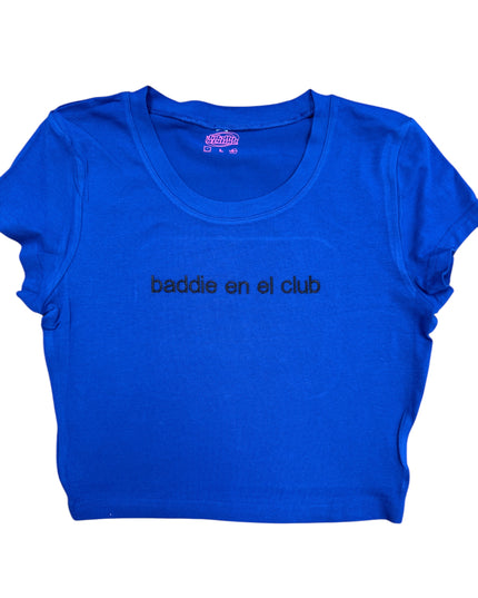 a blue shirt that says baddie en el club