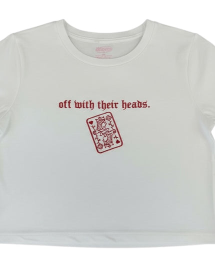 A white t-shirt with the text "off with their heads" printed on it, along with a red graphic of a playing card.