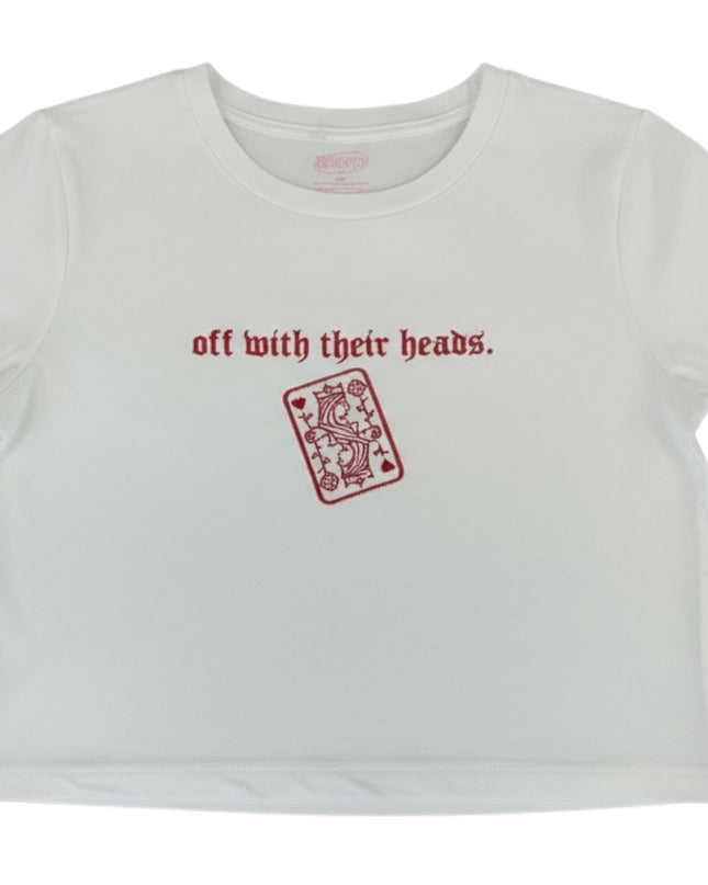 A white t-shirt with the text "off with their heads" printed on it, along with a red graphic of a playing card.