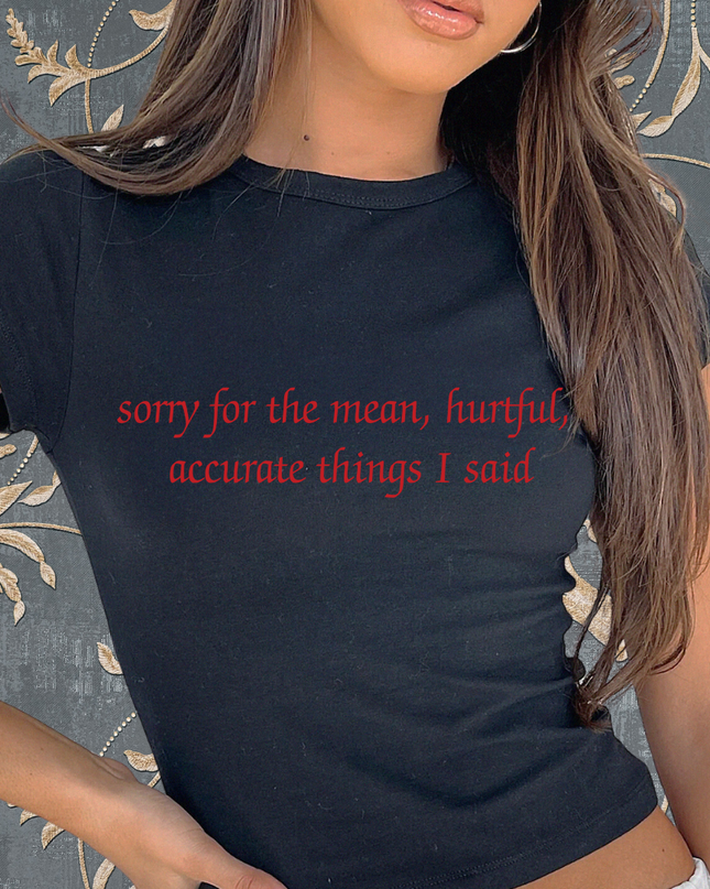 a woman wearing a black shirt with red writing on it