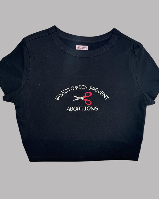 a black t - shirt with scissors on it