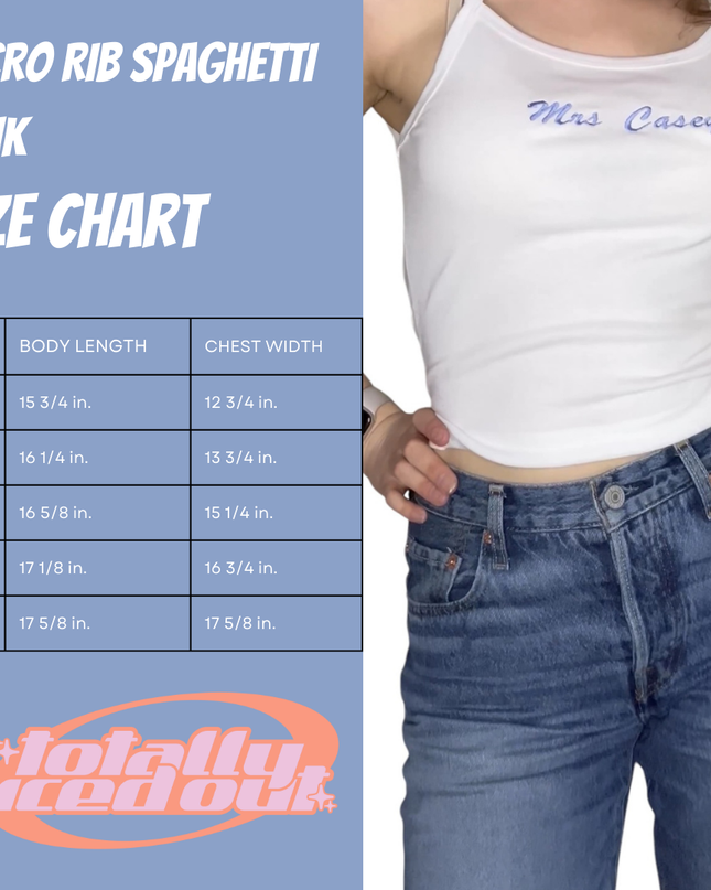 a woman wearing a white tank top and jeans