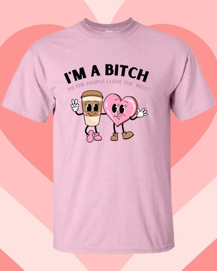 a pink t - shirt that says i'm a bitch with two heart shaped