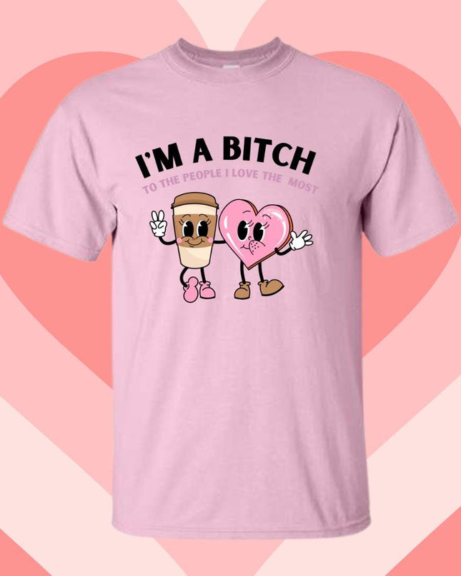 a pink t - shirt that says i'm a bitch with two heart shaped