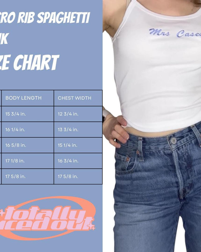 a woman wearing a white tank top and jeans