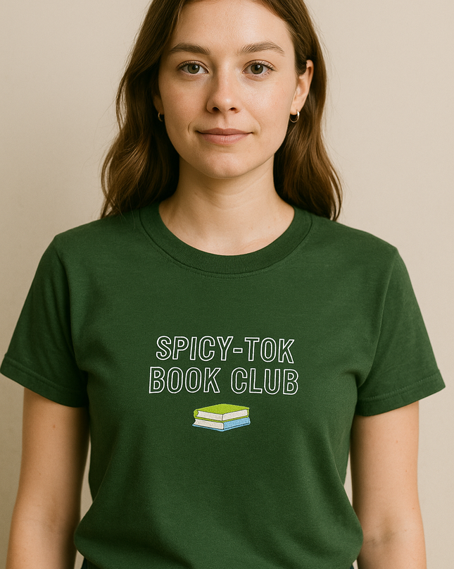 A woman wearing a green t-shirt with the text "SPICY-TOK BOOK CLUB" printed on it.