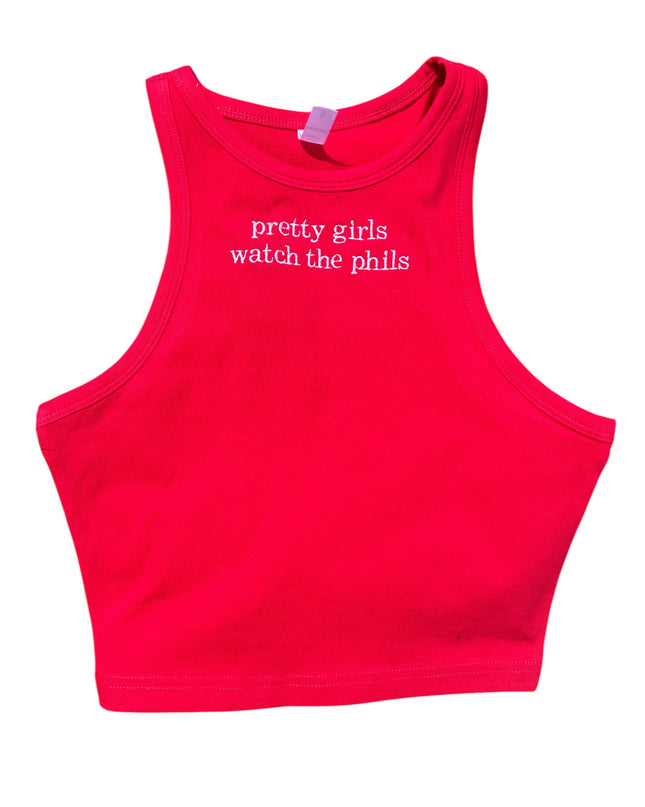 A red crop top with the text "pretty girls watch the phil's" printed on it.