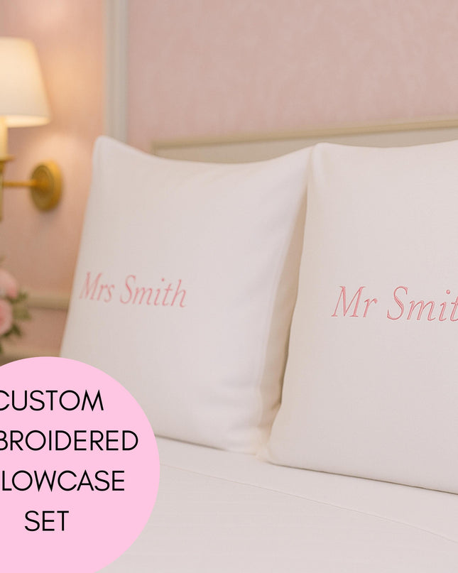 a bed with two pillows and a pillow case