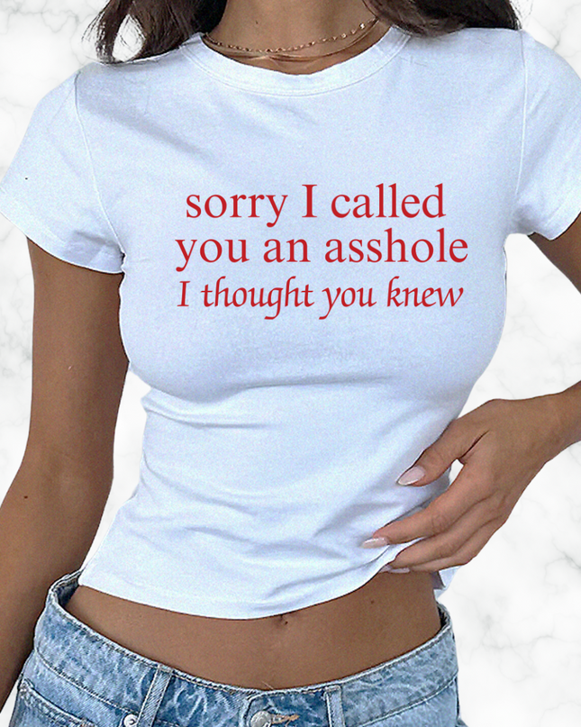 a woman wearing a t - shirt that says sorry i called you an asshole