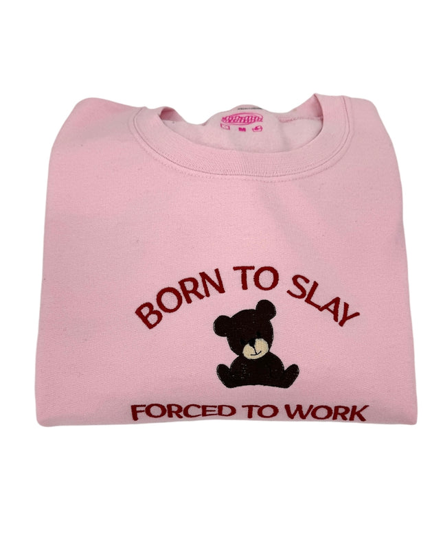 a pink t - shirt with a teddy bear saying born to slay forced to