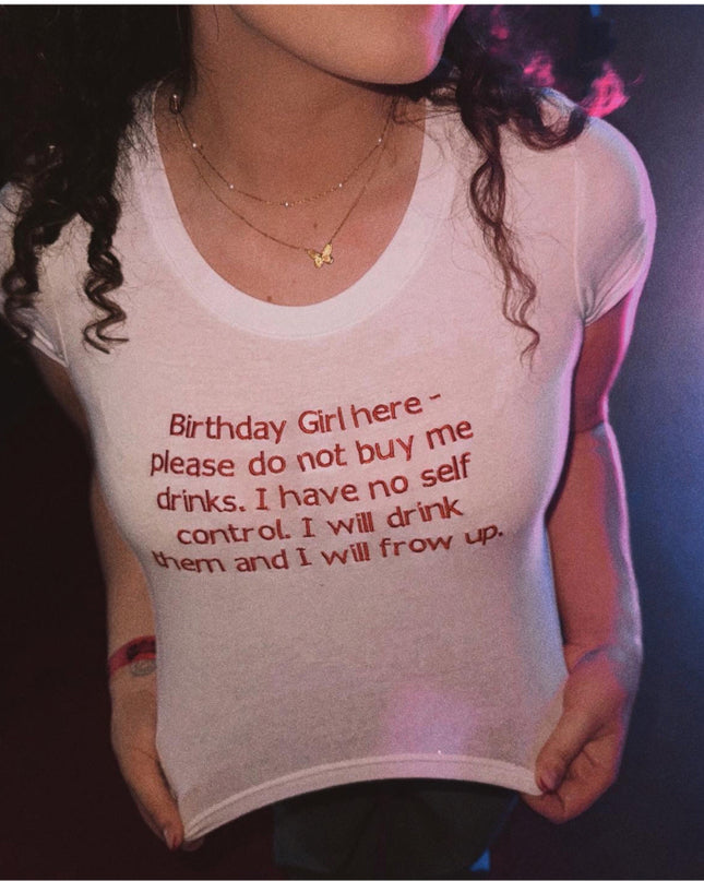 a woman wearing a birthday shirt with a message on it