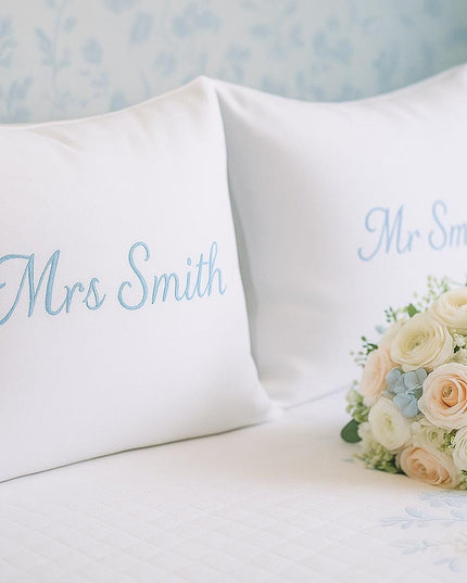a bouquet of flowers sitting on top of a bed