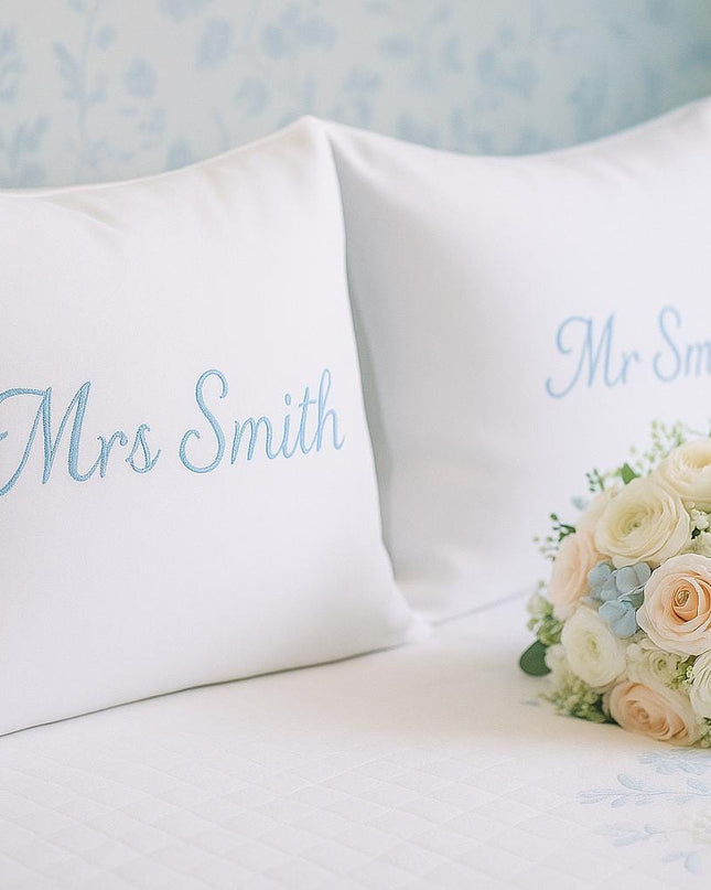 a bouquet of flowers sitting on top of a bed
