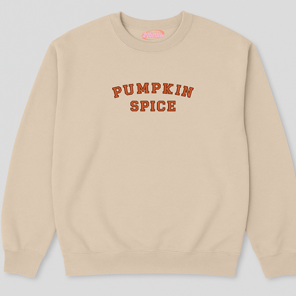 A beige sweatshirt with the text "PUMPKIN SPICE" printed on it in orange letters.