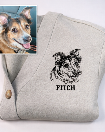 a gray sweater with a black and white embroidered image of a dog's face and the word "FITCH" printed on it.