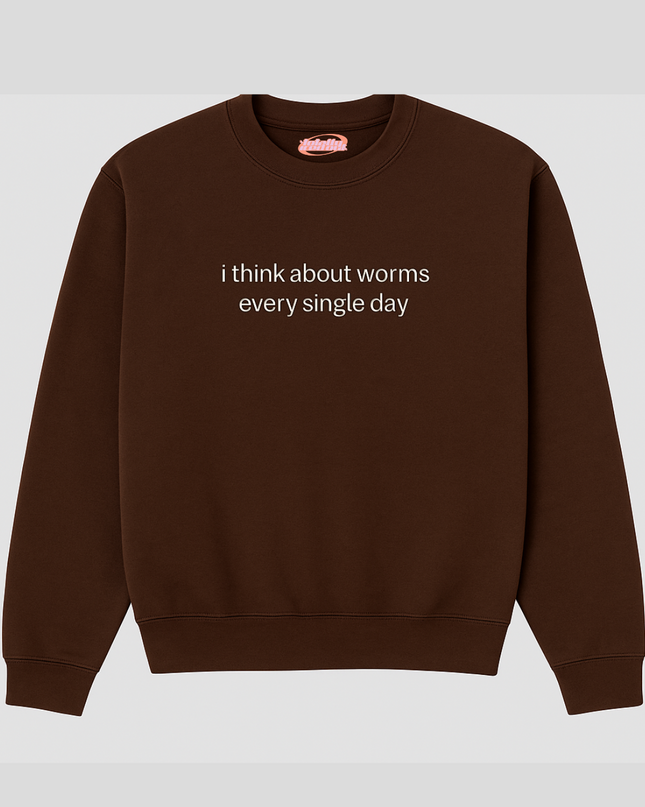 A brown sweatshirt with the text "I think about worms every single day" printed on it.