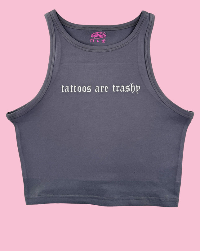 a women's crop top with the words tattoos actually printed on it