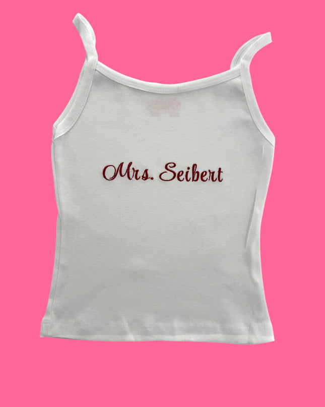 a white tank top with the word mrs seibet printed on it