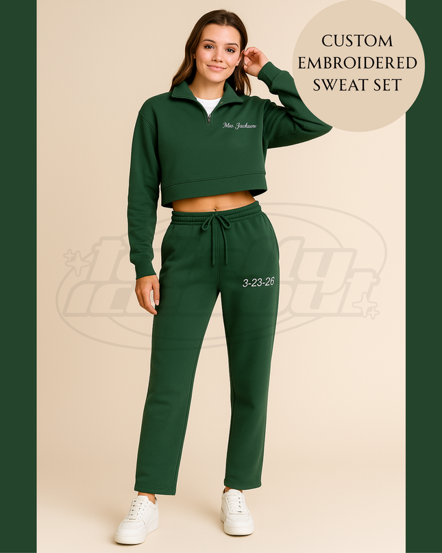 A woman wearing a green cropped sweatshirt and matching green sweatpants, posing for a photograph.