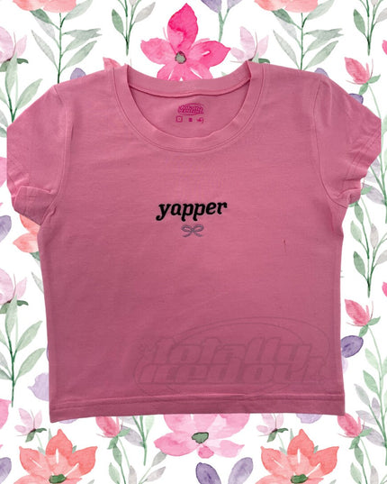 a pink t - shirt with the word yoper printed on it