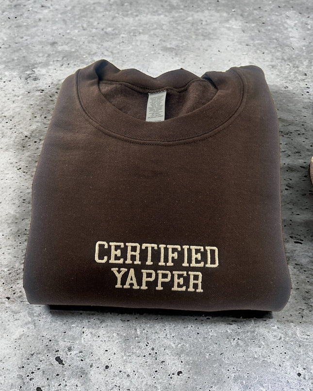 a brown t - shirt with the words certified yapper on it