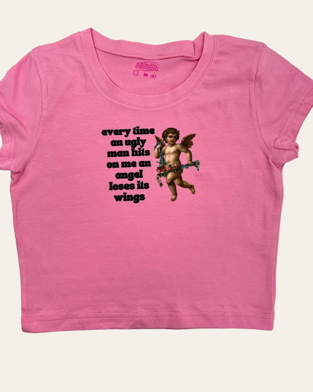 a pink shirt with an image of a cupid angel on it