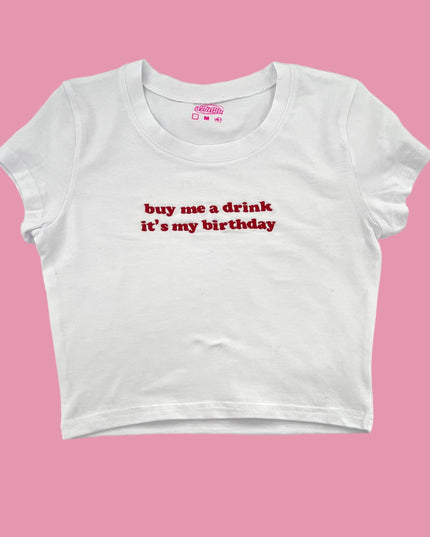 a white crop top that says, buy me a drink it&#39;s my birthday