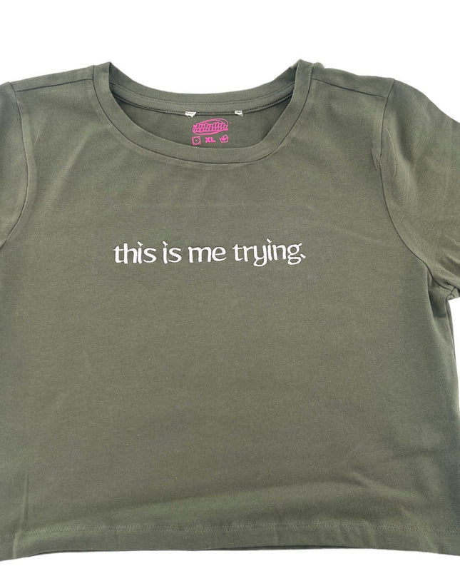 a t - shirt that says, this is me trying