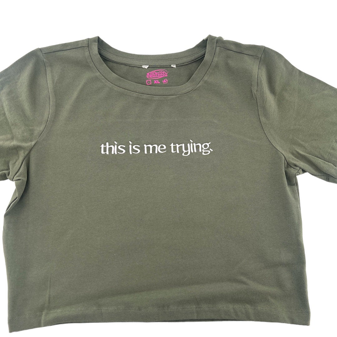 a t - shirt that says, this is me trying