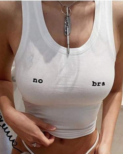 a woman in a white tank top holding a cell phone