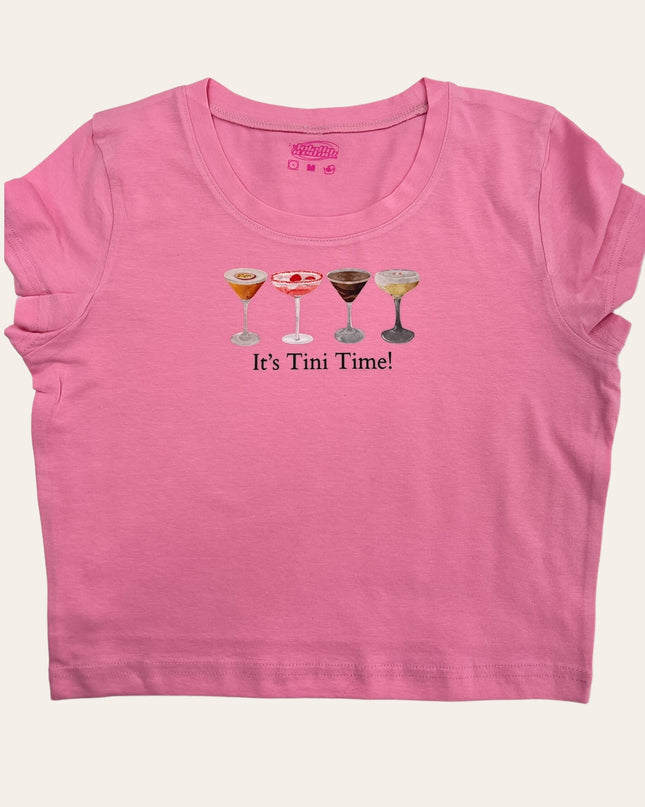 a pink shirt with two glasses of wine on it